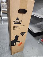 Tall boxed Bissell PowerSteamer Heavy Duty model 2685A packaging showing dog silhouette and brand logo.