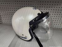 Front-right angled view of glossy white Shoei RJ-101V helmet with clear visor, showing logo and model markings.