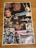 Photo of the full Star Trek collage poster laid flat on a wooden floor showing characters, spaceship and scene imagery.