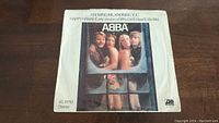 Front of ABBA 45rpm vinyl single sleeve showing the band photo and song titles Knowing Me, Knowing You and Happy Hawaii (early version of Why Did It Have To Be Me).