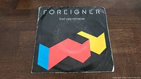 Front cover of Foreigner 45 RPM vinyl single showing the band name and song title with geometric design.