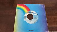 Photo of Golden Earring 'Radar Love' 45rpm vinyl record in MCA Records paper sleeve with rainbow design