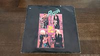 Front side of Poison Talk Dirty To Me 45rpm vinyl single cardboard sleeve showing band member photos and title