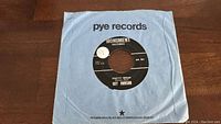 Photo of Pretty Woman 45rpm record by Roy Orbison with original Pye Records sleeve