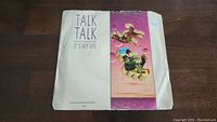 Front of the vinyl single sleeve with Talk Talk 'It's My Life' title and colorful puzzle-themed artwork