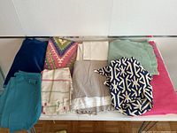 Top view of the entire fabric lot showing all different colors and patterns laid flat.