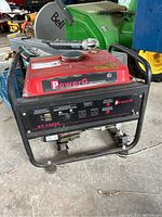 Front view of PowerG GT-1200C petroleum generator showing red fuel tank housing, protective outer metal frame, power outlets, and control switches.