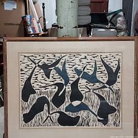 Full view of framed abstract waterfowl print with visible signs of age on wood frame and matting.