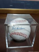 Front view of autographed baseball inside acrylic display case showing Richie Ashburn signature.