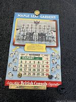 Full view of Maple Leaf Gardens 1947 calendar showing team photo, November page and British Consols cigarette ad.