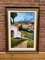 Full view of framed painting showing Mediterranean landscape scene