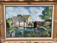 Front view of painting showing house and water scene in ornate wooden frame