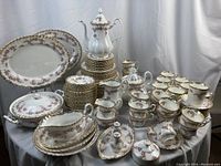 Full collection arranged on table showing pots, cups, plates and platters