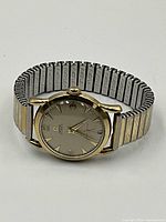 Front view of watch on white background showing dial, case and band