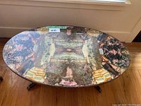 Full view of oval mosaic tabletop and metal legs