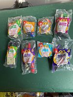 Complete set of 8 McDonald's Happy Meal toys from Inspector Gadget 1999 series in original sealed packaging