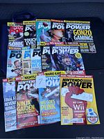 Photo showing 15 Nintendo Power magazines with colorful covers focusing on Wii and Nintendo games.