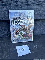 Photo of sealed Wii game Tournament of Legends game case showing front cover artwork and rating.