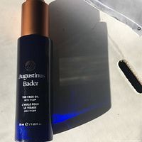 Front view of the blue bottle showing brand name and product details including volume (30 ml/1 US fl. oz).