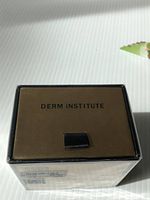 Top of box showing “DERM INSTITUTE” branding