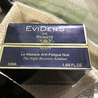 Top and front view of the Evidens de Beauté boxed skincare product, showing brand, product name, size and volume.