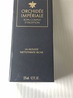 Front view of the navy box with gold text indicating 'Orchidée Impériale Soin Complet d'Exception La Mousse Nettoyante Riche 125ml 4.2fl oz'.