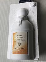 Front view of Guerlain Aqua Allegoria Harvest Mandarine Basilic perfume bottle in white opaque packaging with embossed details and branded label.