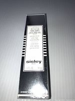 Front of sealed box showing product name, branding, and volume
