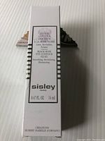 Front side of the Sisley Black Rose Eye Contour Fluid box showing product name and details including 14 ml volume.