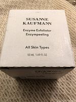Front of the white box with product name, type, skin type suitability, and volume.