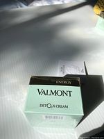 Top and front view of new Valmont Detox Cream sealed box showing product name and branding