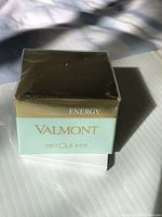 Front view of sealed Valmont Detox Eye Vitality Cream box with gold and aqua color scheme, showing brand and product line.
