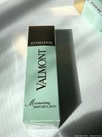 Front of light blue box with black top showing 'Valmont Moisturizing Serumulsion Hydration'.