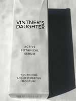 Front view of white box with product name and description.