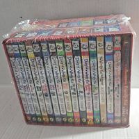 Side view of the sealed box set showing the spine of the 16 hardcover books arranged in order with colorful spines and character illustrations.