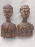Pair of vintage hand carved wood statues, front view