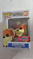 Front view of the boxed Pokemon Growlithe Funko Pop vinyl figure, model 597, with sticker showing 2020 Fall Convention Limited Edition.