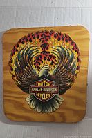 Full view of handmade wooden plaque featuring flaming eagle and Harley Davidson logo.