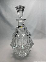 Front view of the Bohemia lead crystal decanter with stopper in place, showing clear geometric patterned body and stopper.