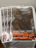 Four unopened packages of Champion Visicolor Zombie Targets, showing the front of the packaging with zombie artwork and branding.