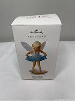 Front of the original box showing the Hallmark Keepsake Beach Fairy ornament image and branding.