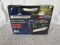 Front view of boxed Mastercraft air-powered stapler showing brand, model info, and product image.