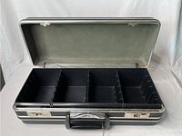 Open view of the vintage 8-track case showing the divided compartments and removable black plastic tray inside, lined with fabric.