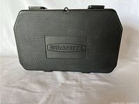 Closed black hard plastic case with Workforce logo on front