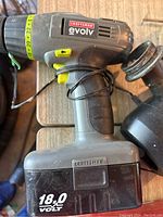 Photo of Craftsman Evolv cordless drill showing 18.0V battery and drill body with yellow markings.