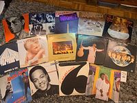Image showing 15 vinyl records with visible album covers from artists Van Halen, Peabo Bryson, Jambo & Co., George Benson, Deep Purple, Rare Earth, Keith Sykes, Yarbrough & Peoples, Tommy Tutone and more.