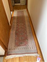 Full view of the Persian runner rug laid out on hardwood floor, showing overall pattern and length.