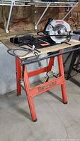 Full view of Hirsh folding saw table with Craftsman circular saw on top, power cord coiled, showing the table height and structure.