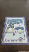 Front of the 1981-82 Topps Ray Bourque hockey card showing player in Bruins uniform on ice.