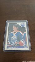 Front view of 1985-86 O-Pee-Chee Jari Kurri hockey card, showing player image in Edmonton Oilers jersey.